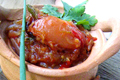 Grilled Pork Marinated in Garlic, Coriander and Pepper Served with Spicy Hot and Sour Tomato Relish
