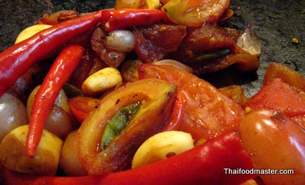 Grilled Pork Marinated in Garlic, Coriander and Pepper Served with Spicy Hot and Sour Tomato Relish